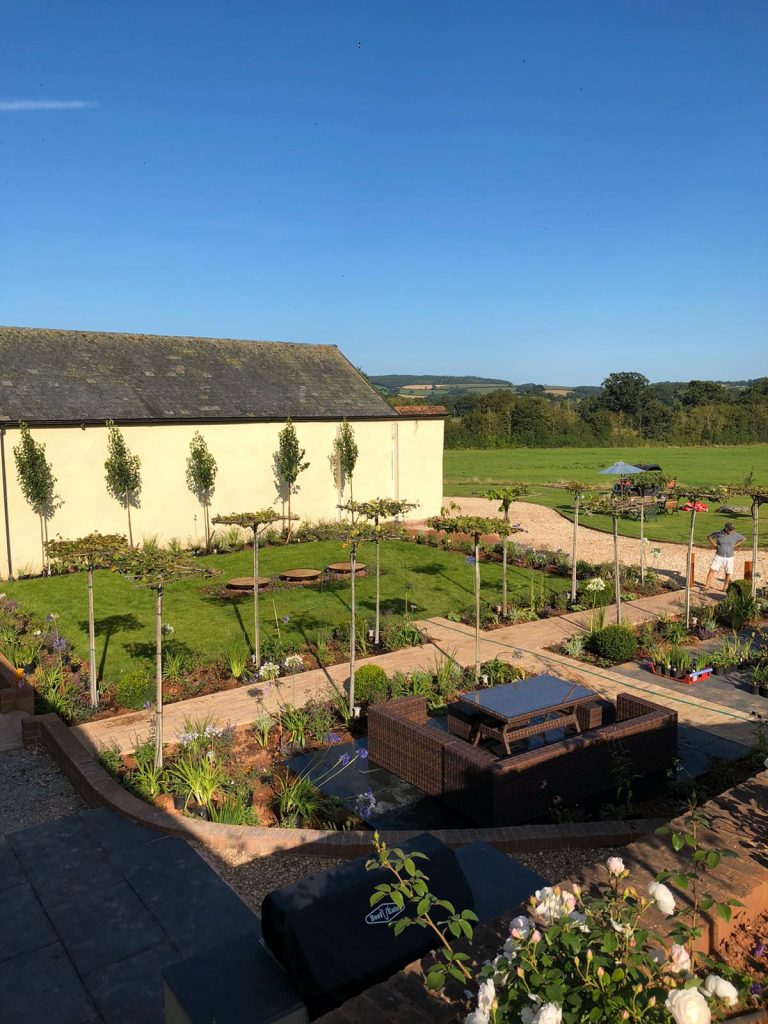 Edward Grimes Garden Designer - Garden in Silverton, Exeter in Devon - Garden and picnic bench